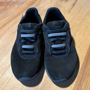 Kids black Nike sneakers